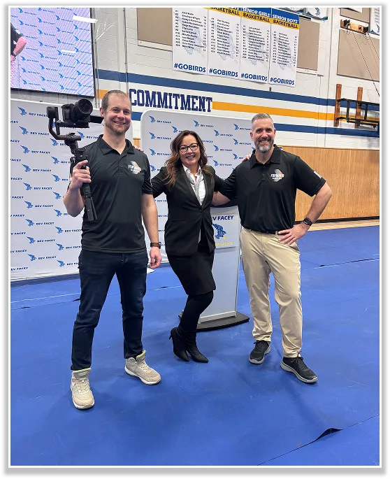 Video marketing services Calgary team celebrating success in a gymnasium setting