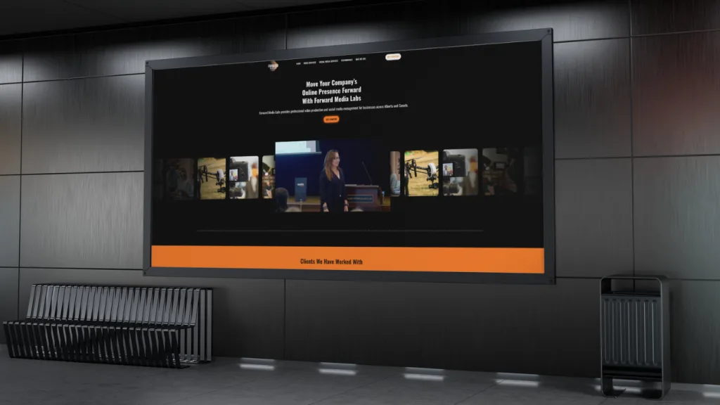 Website design Calgary showcased on a large screen with engaging media content and a speaker