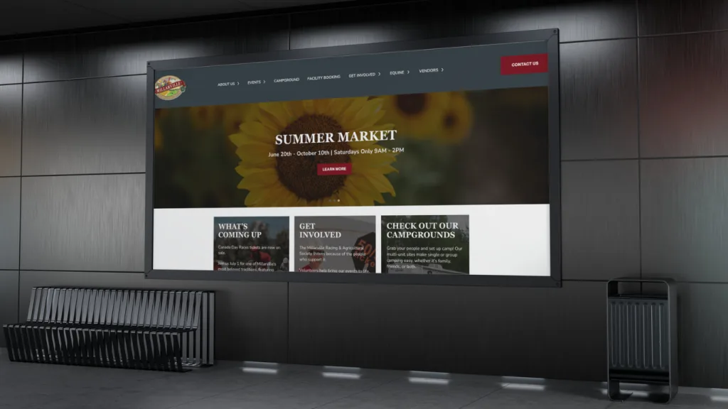 Website design Calgary showcasing a vibrant summer market with sunflowers and event details on a large screen